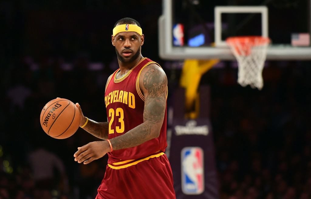 LeBron James of the Cleveland Cavaliers looks to pass against the Los Angeles Lakers during their NBA game at Staples Center in Los Angeles, California on January 15, 2014. AFP PHOTO/Frederic J. BROWN (Photo credit should read FREDERIC J. BROWN/AFP/Getty Images)